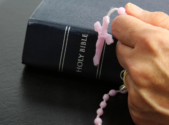 a bible and a rosary